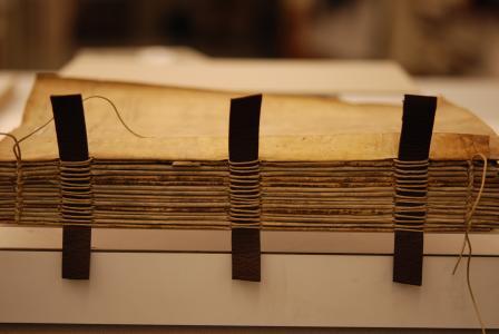 Completed sewing of the text block on leather supports. Photo by Deborah Howe, courtesy of Dartmouth College Library.
