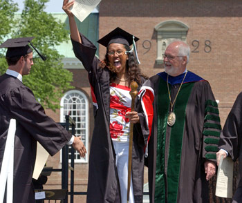 Michaella Frederick '04 rejoices after receiving her diploma from President Wright