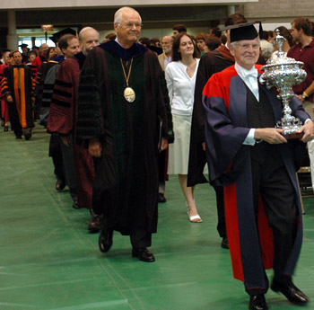 Academic procession led by Edward Connery Latham, carrying the Lord Dartmouth's Cup