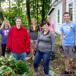 Dartmouth employees volunteering and gardening at Hixon House